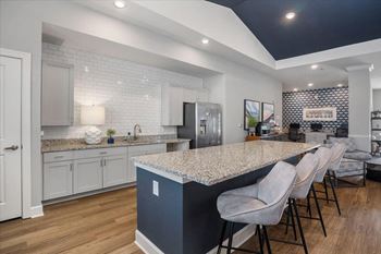 a kitchen with a counter top and a bar